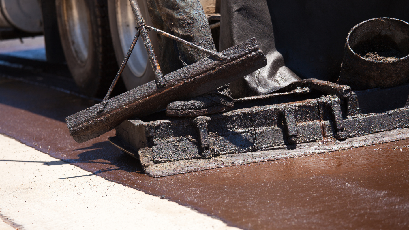 A close up of a piece of metal on the ground