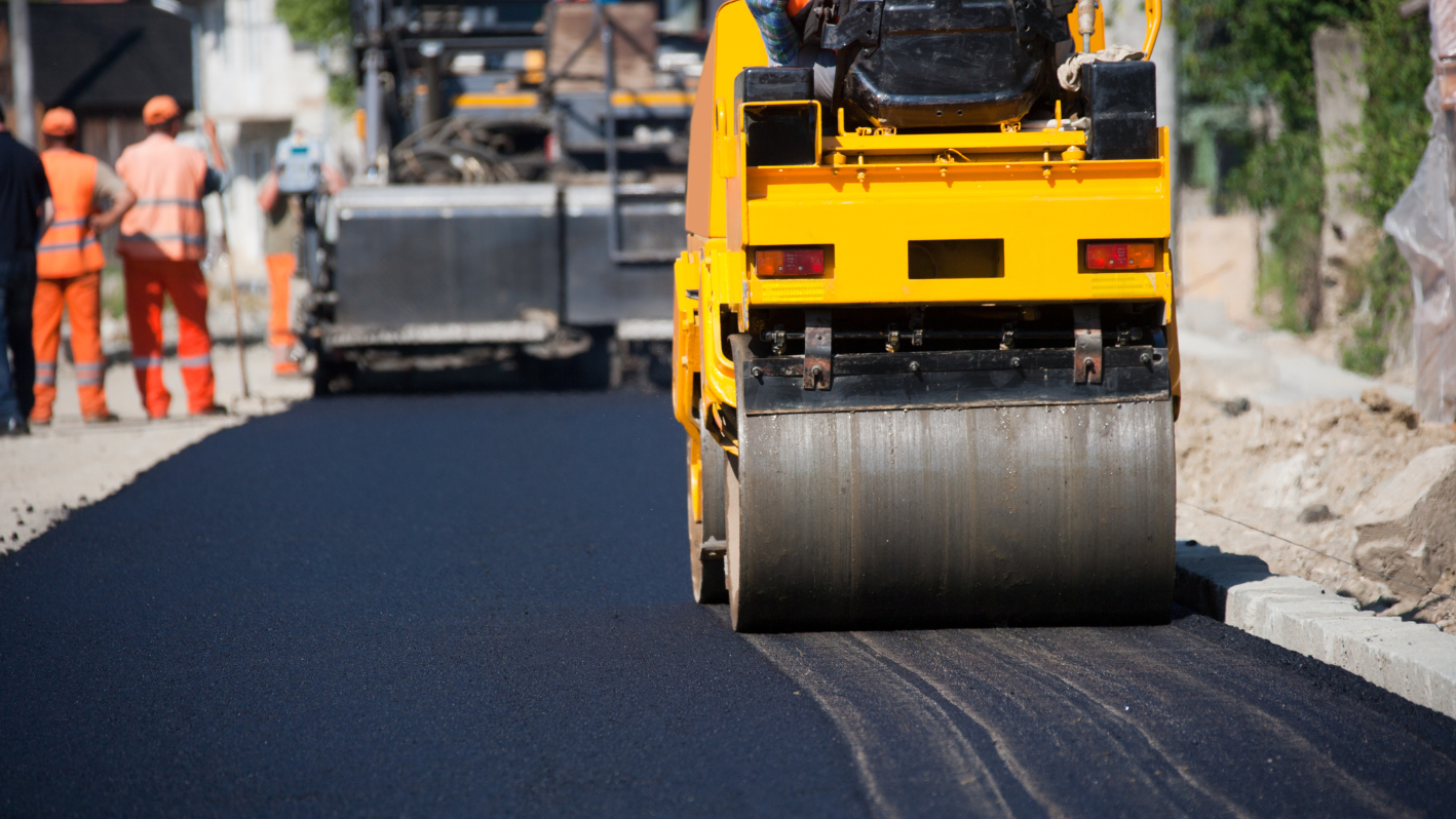 A road being paved with a road roller